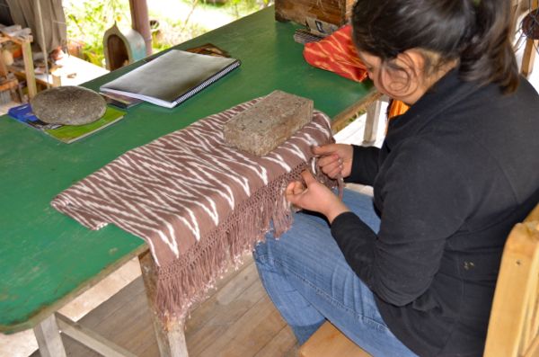 Monica Jimenez, daughter of Jose, uses the fingernail technique on a shawl. Photo by Keith Hajovsky.